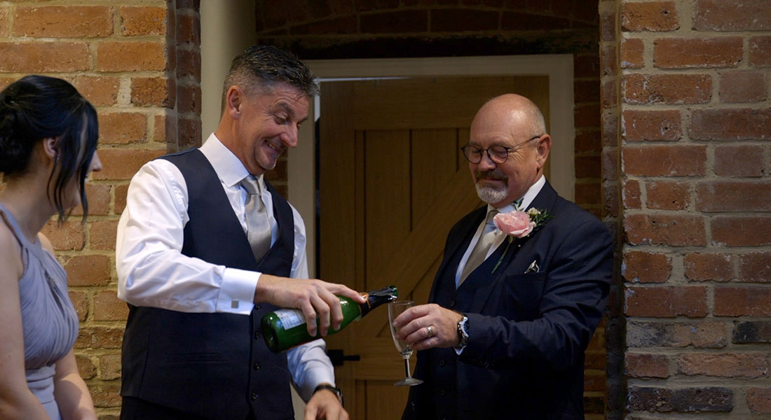 Video still of toasts, filmed in Staffordshire by Wedding Stories by Hannah Quinn